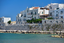 houses from the coast of Vieste on a sunny day, Puglia region, Italy