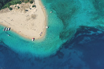 aerial view over iconic small uninhabited island of Marathonisi featuring clear water sandy shore and natural hatchery of Caretta-Caretta sea turtles, Zakynthos island, Ionian, Greece