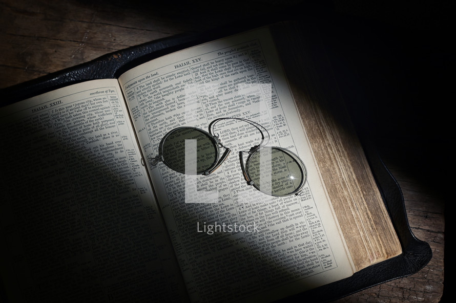 light on the pages of a Bible 