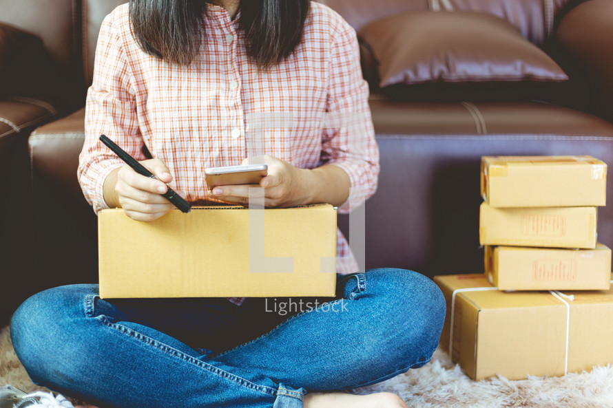 woman mailing packages from home 