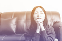 a woman praying looking up to God 