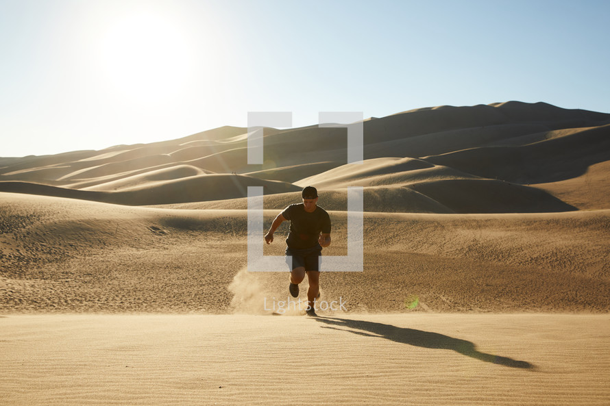 a man running in sand 