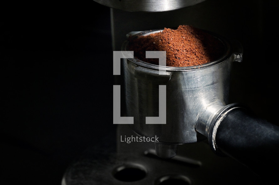 ground coffee in an espresso machine 