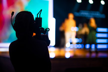 videographer filming a worship service 