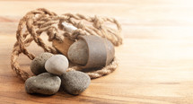 A Sling Shot and Stones on a Wooden Table from the Story of David and Goliath in the BIble 