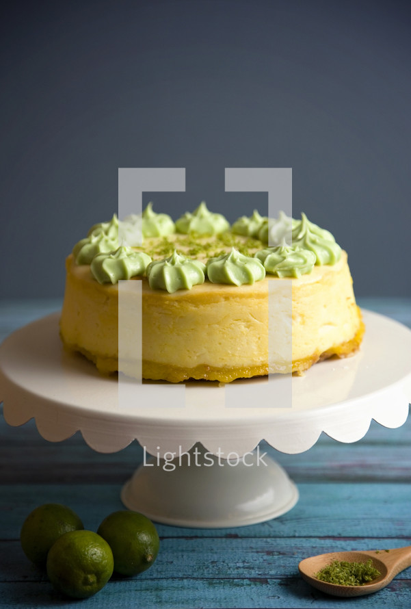 key lime cake on a cake stand 