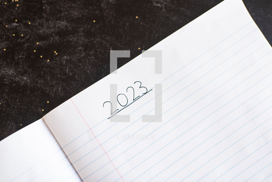 Blank notebook paper with 2023 written on it