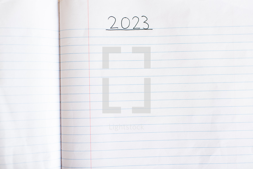 Blank notebook paper with 2023 written on it