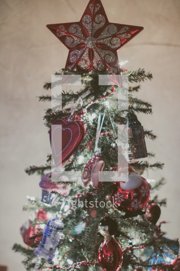 A decorated Christmas tree with a star on top