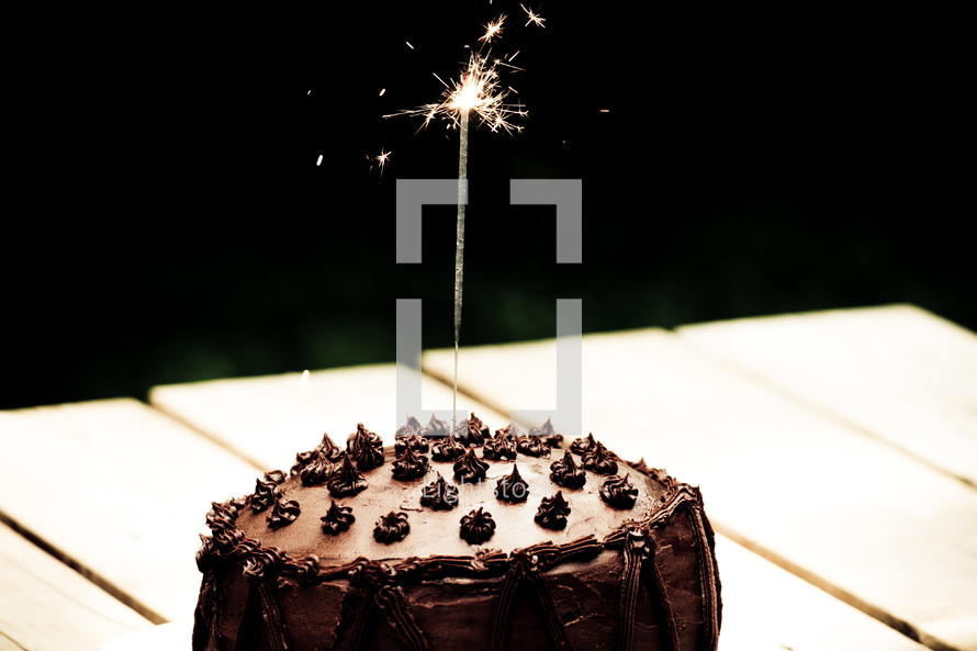 sparkler on a chocolate cake 
