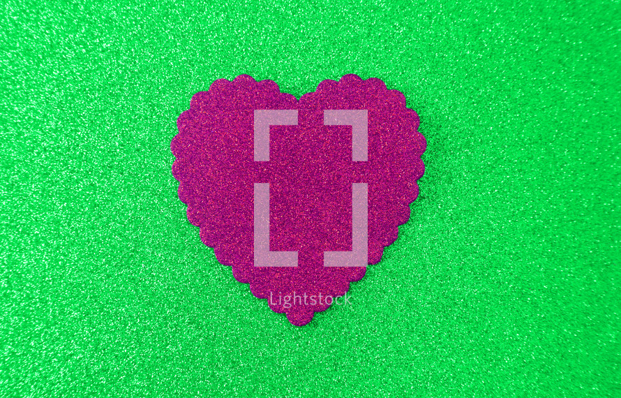 pink heart on green 