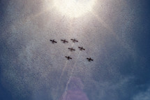 planes in formation at an air show 