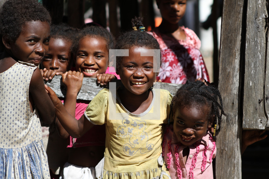young girl orphans smiling and giggling 