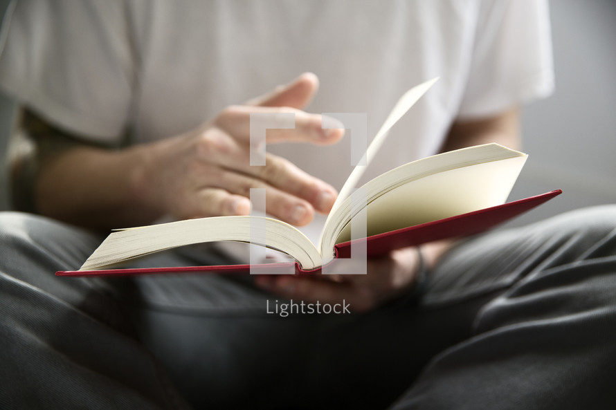a man reading a book.