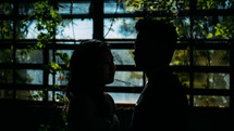 silhouette of a couple standing together 