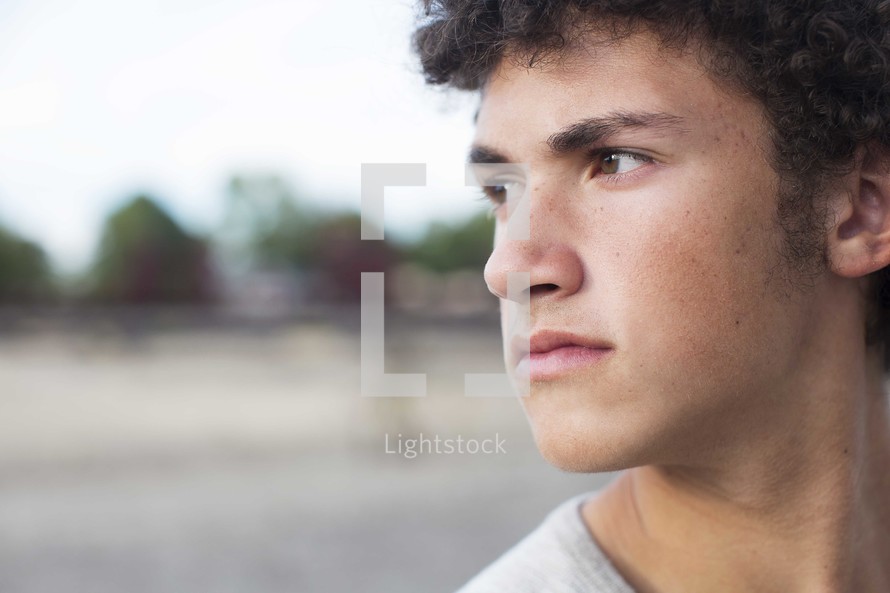 side profile closeup of a teen boy's face 