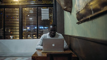 African American man at a laptop computer 
