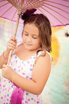 girl child holding a parasol 