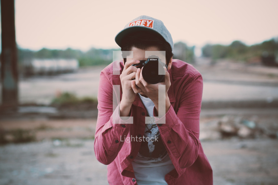 a man taking a picture with a camera 