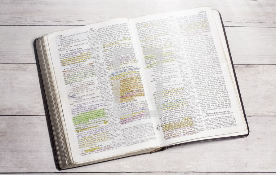 highlighted pages of an opened Bible 