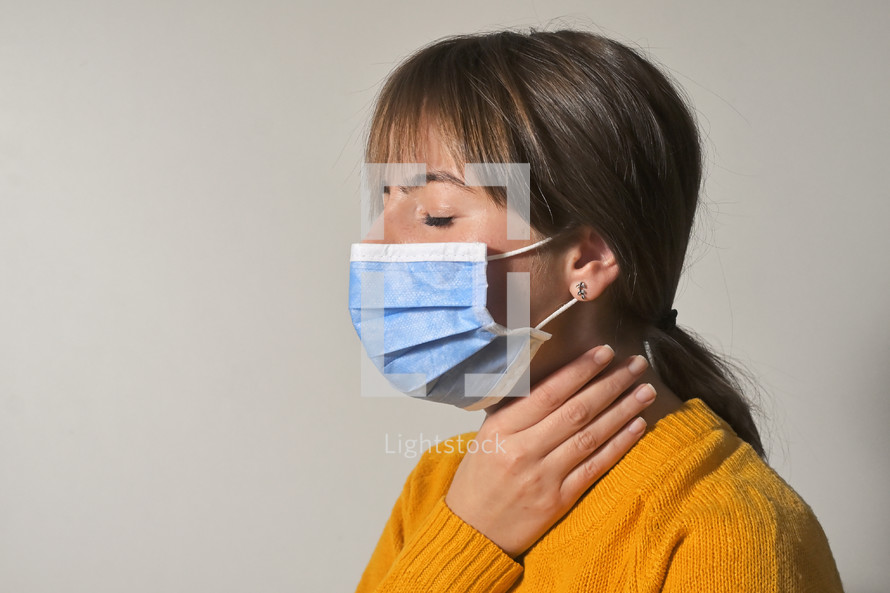 Woman Wearing Medical Protective Mask and Throat Pain