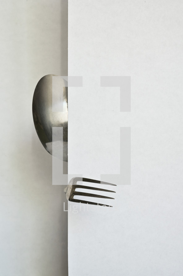 Abstract person from spoon and forks on white background