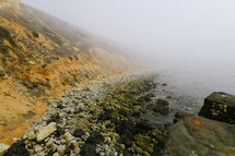 fog over a rocky shore 