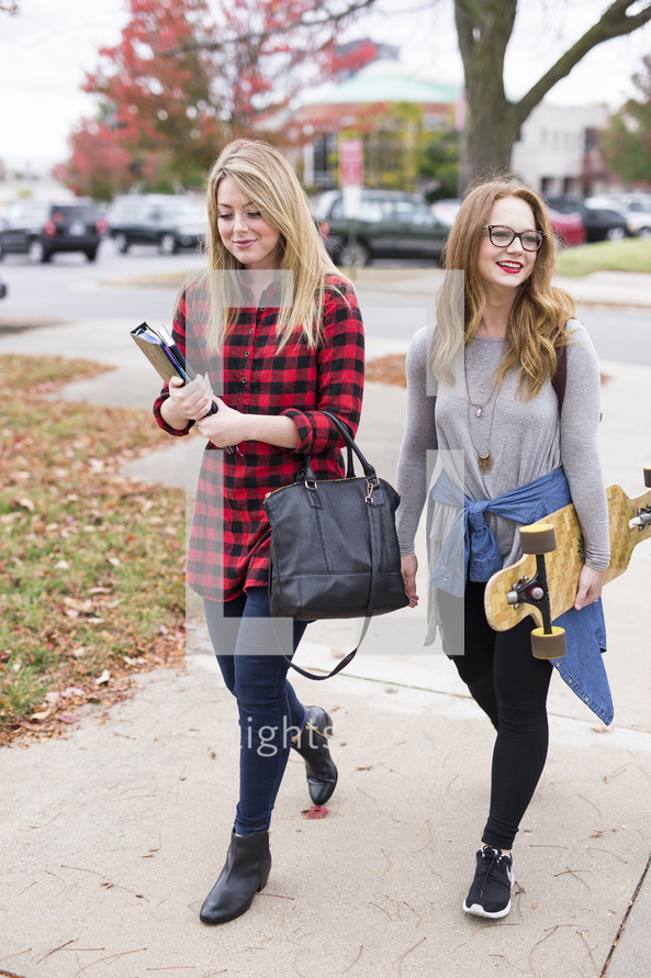 friends walking to class on campus 