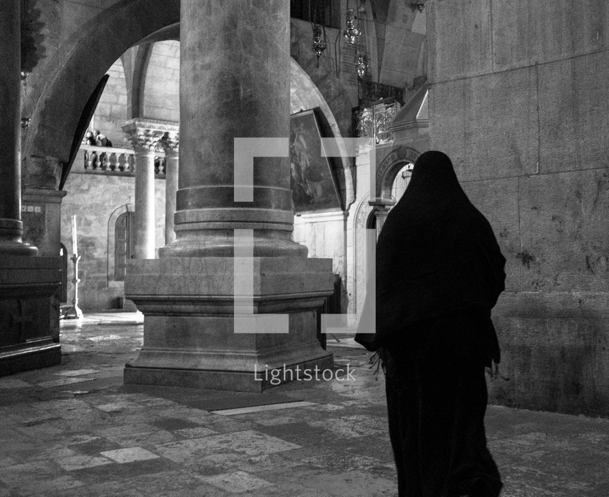 a muslim woman walking in Jerusalem 