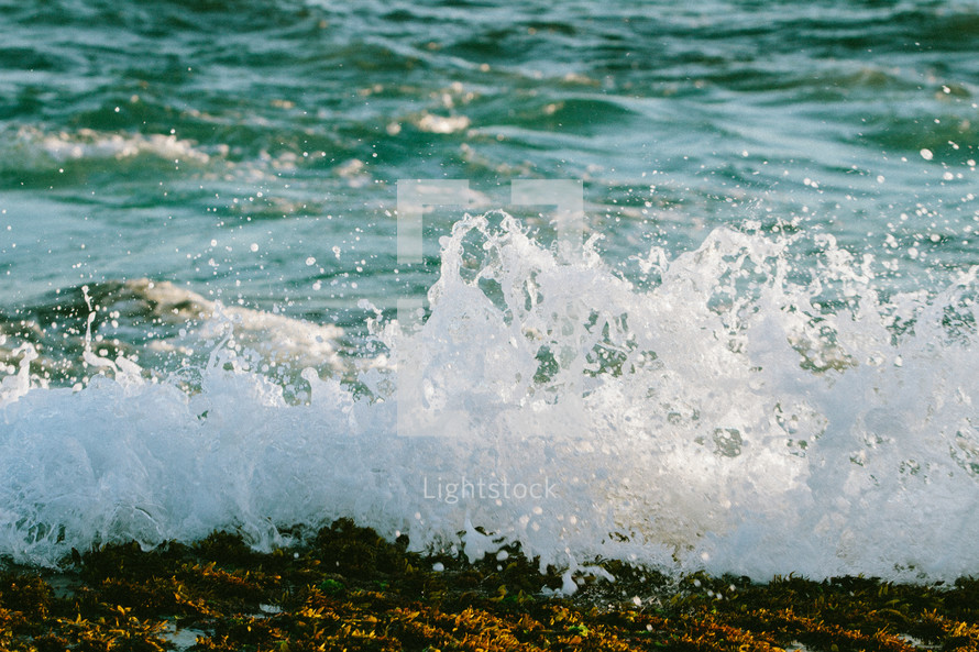 waves crashing onto the shore