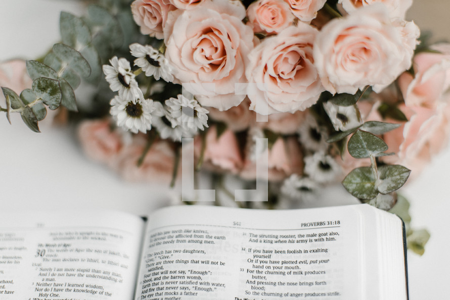 open Bible and flower arrangement 