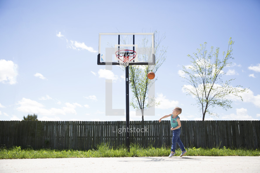 a boy playing basketball 