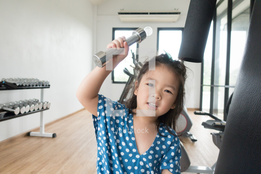 child lifting weights 