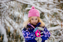 toddler girl in a winter snowsuit 