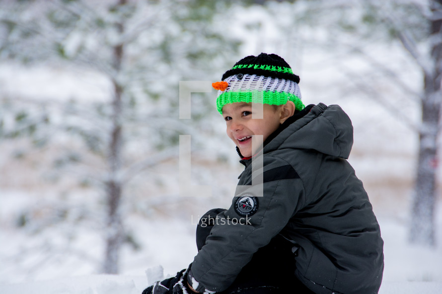 boy child in a winter snowsuit 