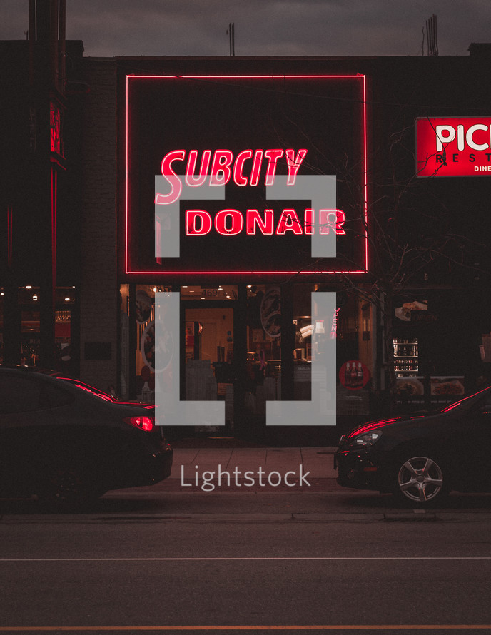 illuminated restaurant sign at night 
