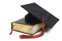 graduation cap and a Bible