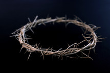 crown of thorns on black background 