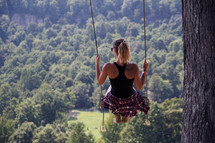 woman on a rope swing 
