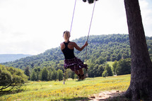 woman on a rope swing 