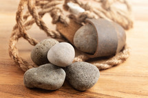 A Sling Shot and Stones on a Wooden Table from the Story of David and Goliath in the BIble 