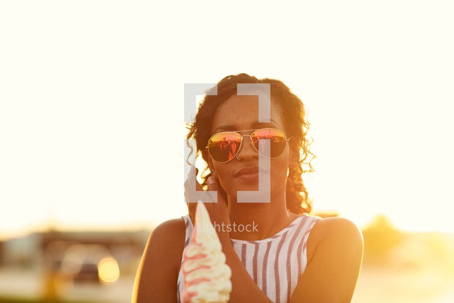 a woman holding an ice cream cone