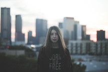 teen girl in a city wearing a Born to be free sweater 