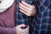 a woman with an engagement ring on her hand 