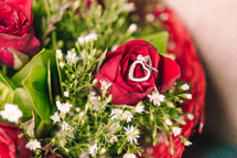 diamond necklace on red roses
