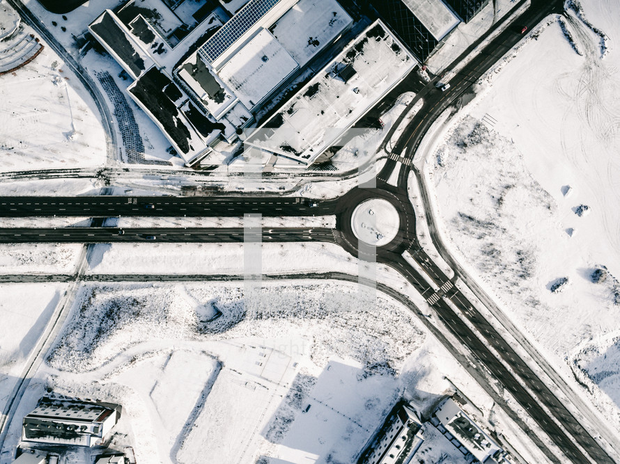 aerial view over a city blanketed in snow 