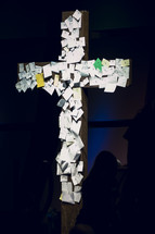 notes attached to a cross