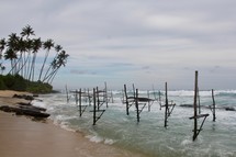 Stilts along a beach for fishing 