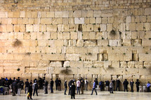 Crowd of people worshipping at the Western or Wailing Wall in Jerusalem.