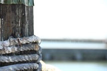 rope around a post on a pier 